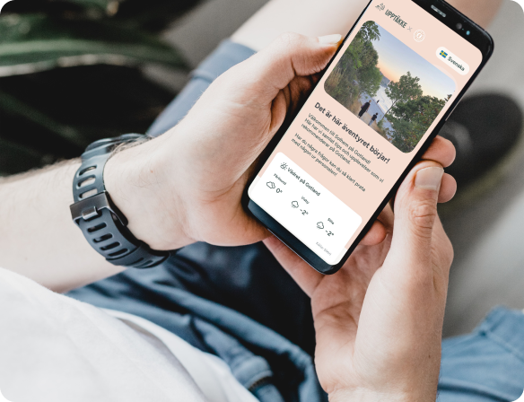Upptäkke AB mobilapplikation visad på smartphone - digital lösning för besöksnäringen utvecklad med hjälp av Berrycloud Consulting